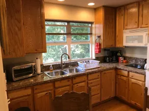 Cozy cabin-like studio above freestanding garage - Image 2