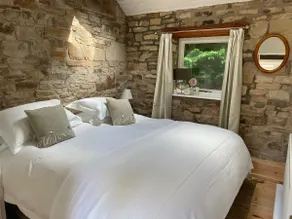 Magical cottage surrounded by trees and water - Image 2