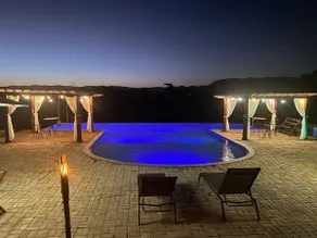 A chalet, spa, and swimming pool. - Image 5