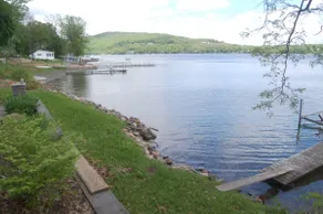 Rare Find! 140' Lake Frontage w dock & boat hoist - Image 2