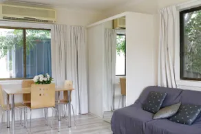 Clean, queen bed with cooking facilities. - Image 4