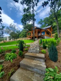 A cozy house in Kikiti with a fireplace and a beautiful yard. - Image 3