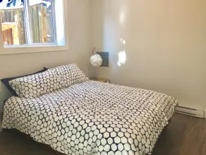 Bright two bedroom suite in character home - Image 2