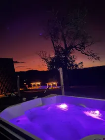 A chalet, spa, and swimming pool. - Image 4