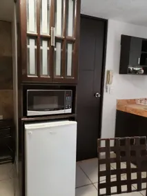 Comfortable room with a kitchenette and nice finishes - Image 4