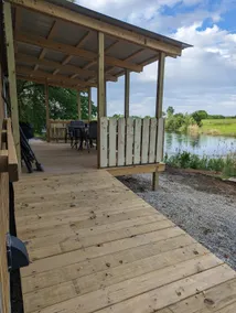 The Sunnyside is a unique 14x40 cabin by the water - Image 4