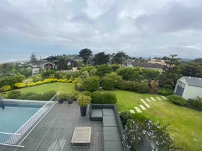 Modern house with ocean views and a large garden. - Image 2