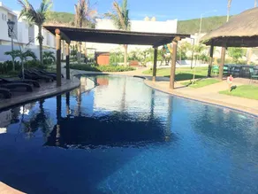 House near the beach in a private community with a pool - Image 5