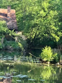 Secluded cottage on a river below a medieval town - Image 5