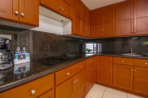 A condominium in front of the pool and beach - Image 3
