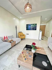 Chic 2BR Getaway with Large Balcony and Central AC - Image 4