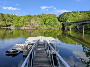 Luxurious cabin with fire pit, kayaks, and dock. - Image 4