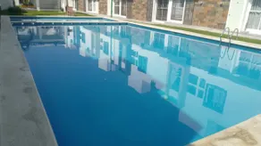 House in front of a beautiful pool - Image 4