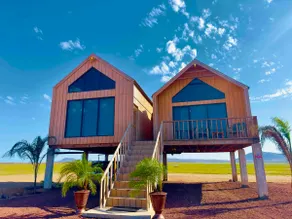 Cabins in a volcanic valley - Image 2