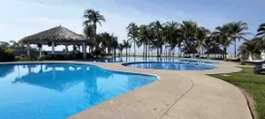 A vacation home with a pool and beach club - Image 4