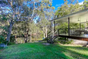Noosa on the river in the bush with fishing kayaks - Image 4