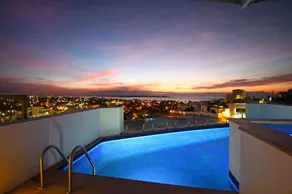 View of the bay, swimming pool, and whirlpool. - Image 4