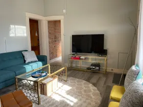 Historic Red Brick Home with Patio & Full Kitchen - Image 2