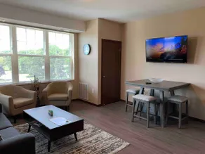 Modern Suite with washer & dryer on I-94 - Image 2