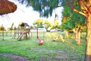 Cabin surrounded by greenery with a pool - Image 5
