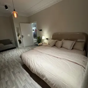Apartment with a living room, two bedrooms and a kitchen with a different design - Image 2