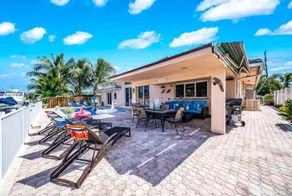 Easygoing Coastal Getaway Pool & Waterfront Patio - Image 2