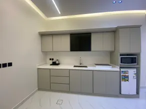 Two-bedroom apartment, living room, and a commercial street - Image 4