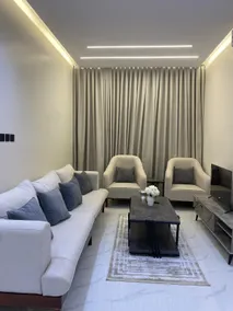 Two-bedroom apartment, living room, and a commercial street - Image 2