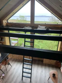 Modern wooden cabin overlooking a half-kilometer wide stretch of water - Image 4