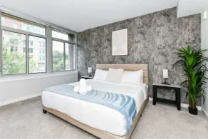 Sleek 2BR Residence with Gym, Parking & Rooftop De - Image 4