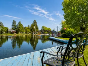 Canalside Summer Cottage with Waterview, Custom Bar, BBQ, and Fireplace - Image 5
