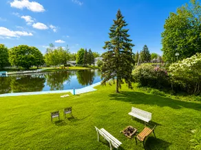Canalside Summer Cottage with Waterview, Custom Bar, BBQ, and Fireplace - Image 4