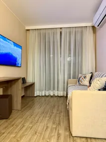 50” Flat-screen TV in the living room and TV in the bedroom - parking - Image 4