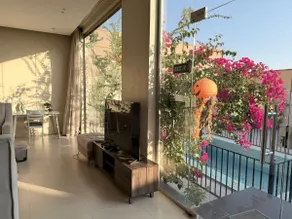 Chalet with a glass view of an outdoor pool - Image 2