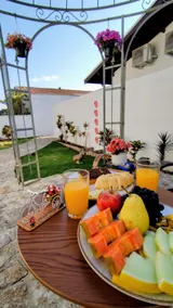 House among cafes and flowers - Image 5