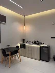 Room and lounge in Al Murooj B, self check-in and coffee corner - Image 4