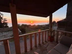 Tiny house with sunset over the ocean - Image 2