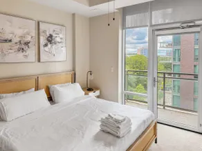 Sunlit 1BR |Tyson High-Rise| Pool + Parking| Patio - Image 2