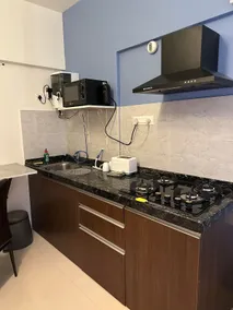 Modern Studio Near EON IT Park | AC, WiFi, Balcony - Image 3
