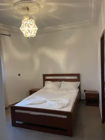 Chic Furnished 1 Bedroom Apartment Yaounde Living Room - Image 3
