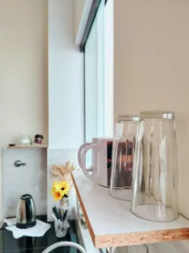 3. Studio: stylish design, kitchen, and rooftop views - Image 5