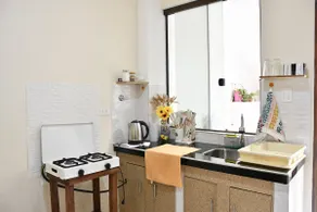 3. Studio: stylish design, kitchen, and rooftop views - Image 4