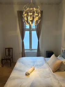 Spacious 3BR Apartment | Family Lounge with TV - Image 3