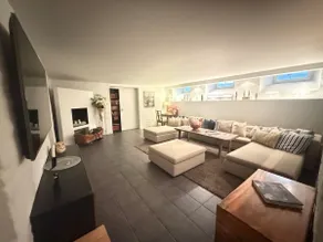 Spacious 3BR Apartment | Family Lounge with TV - Image 4