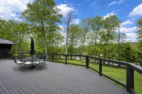 Hideaway large stone mid-century ranch on lake - Image 3