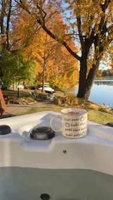Fall colors on the river with kayaks and fire pit - Image 3