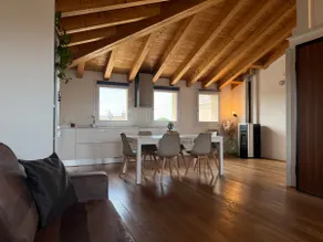 Elegant attic with exposed beams - Image 4