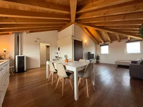 Elegant attic with exposed beams - Image 2