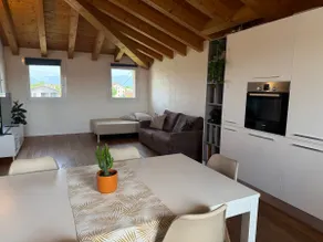 Elegant attic with exposed beams - Image 3