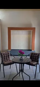 Airport apartment with bedroom, living room and outdoor seating - Image 2